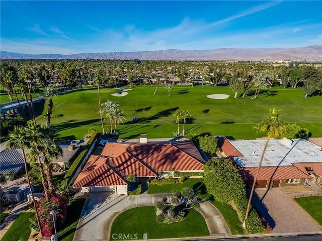 a bathroom with a shower sink and mirror