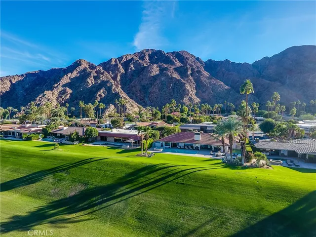 a view of a golf course with a swimming pool