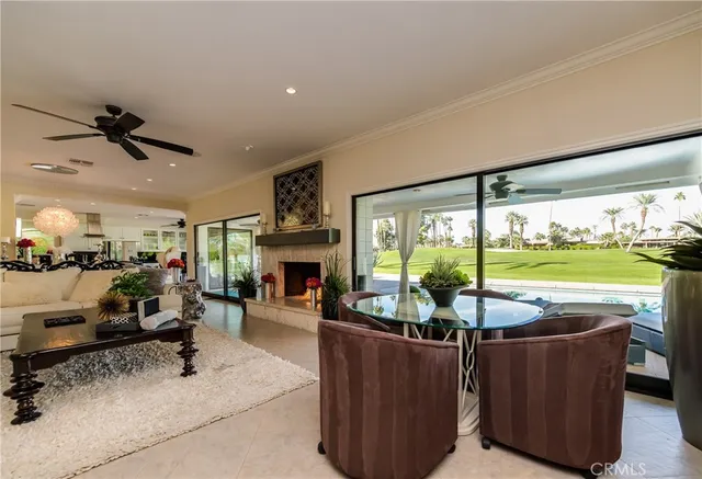 a kitchen with stainless steel appliances kitchen island granite countertop a refrigerator and a stove top oven