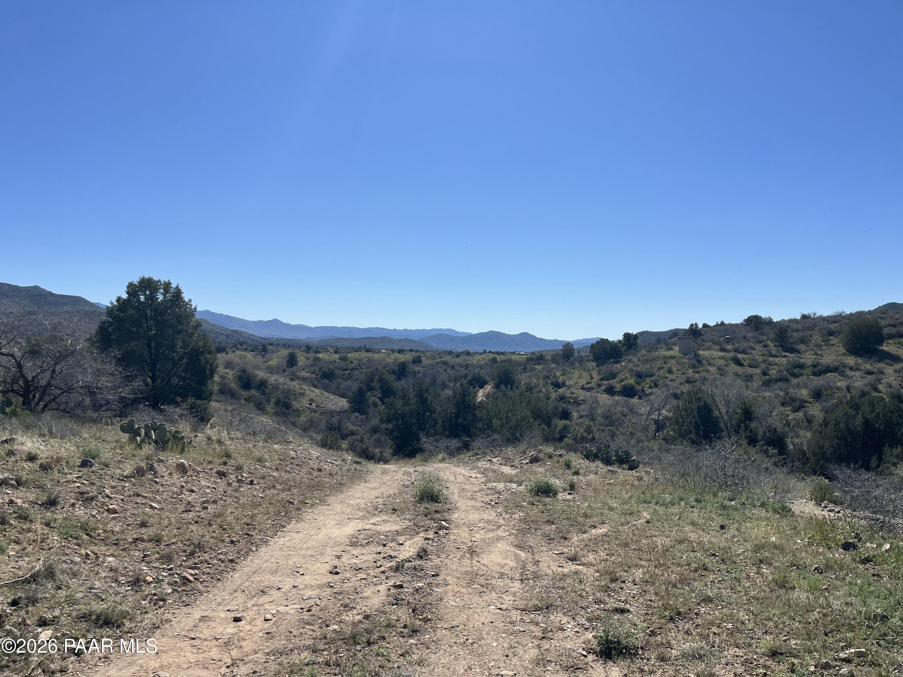 0 South Walnut Grove Road Kirkland, AZ 86332 - Photo 11 of 15 a view of a dry yard with mountains in the background