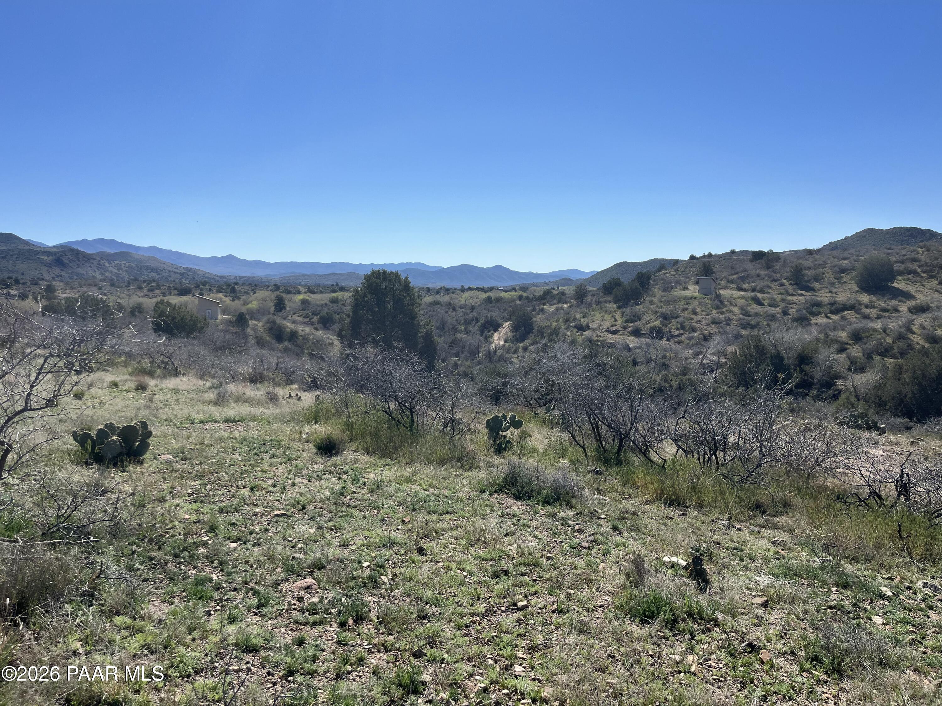 0 South Walnut Grove Road Kirkland, AZ 86332 - Photo 3 of 15 a view of a yard with a house in the background