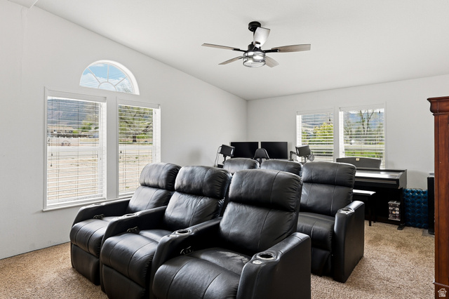 1637 East Midvalley Road Enoch, UT 84721 - Photo 30 of 48 Cinema room featuring light colored carpet, a ceiling fan, and vaulted ceiling