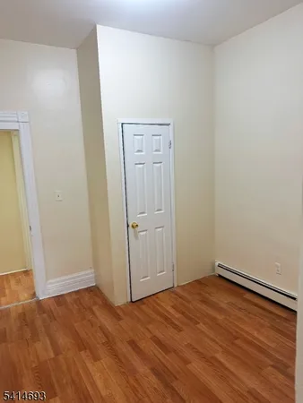 an empty room with wooden floor