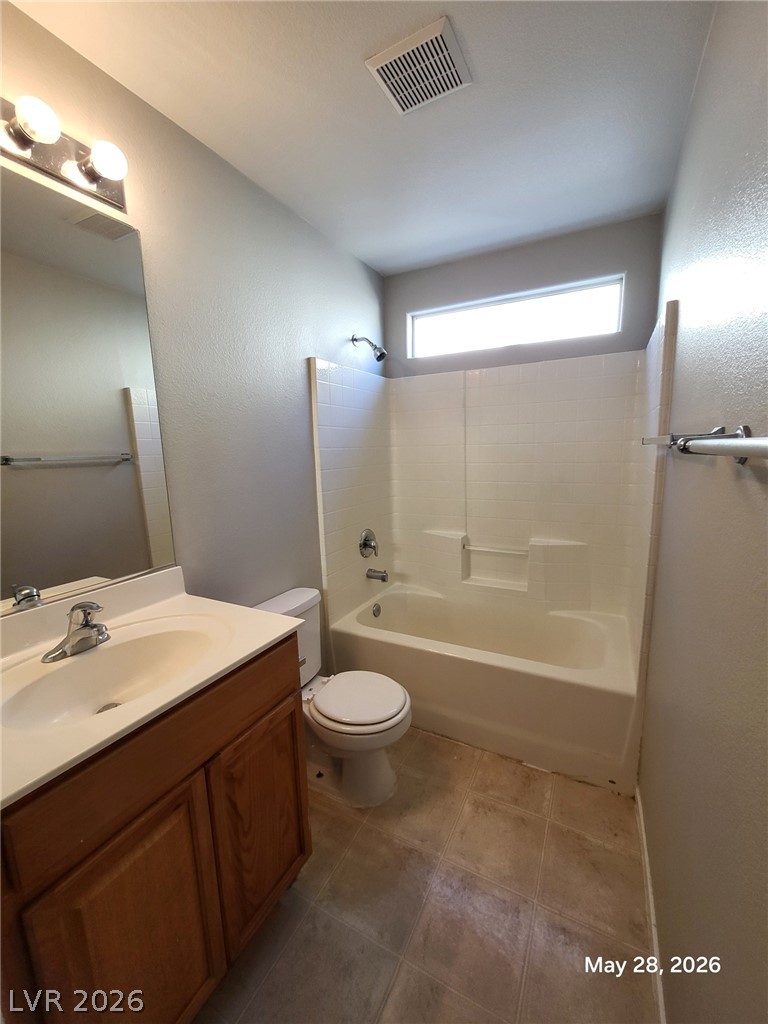 9843 West Overlook Ridge Avenue Las Vegas, NV 89148 - Photo 8 of 19 An essential bathroom with a functional layout features a practical tub and shower combination.