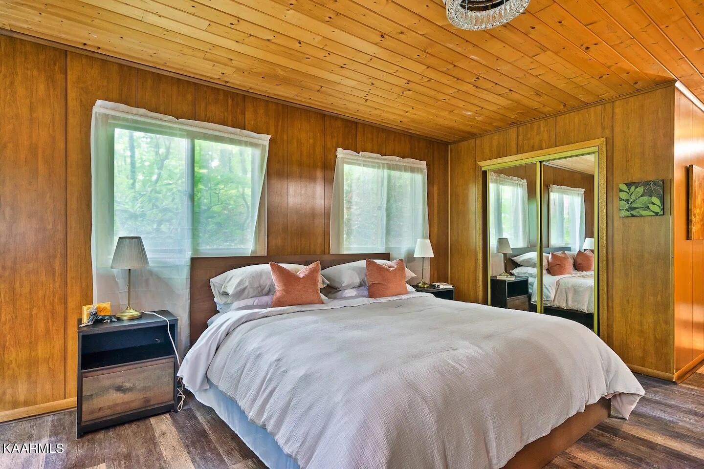 1424 Zurich Road Gatlinburg, TN 37738 - Photo 13 of 27 a bedroom with a bed and large windows