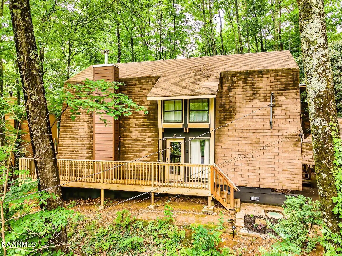1424 Zurich Road Gatlinburg, TN 37738 - Photo 2 of 27 front view of a house with a garden