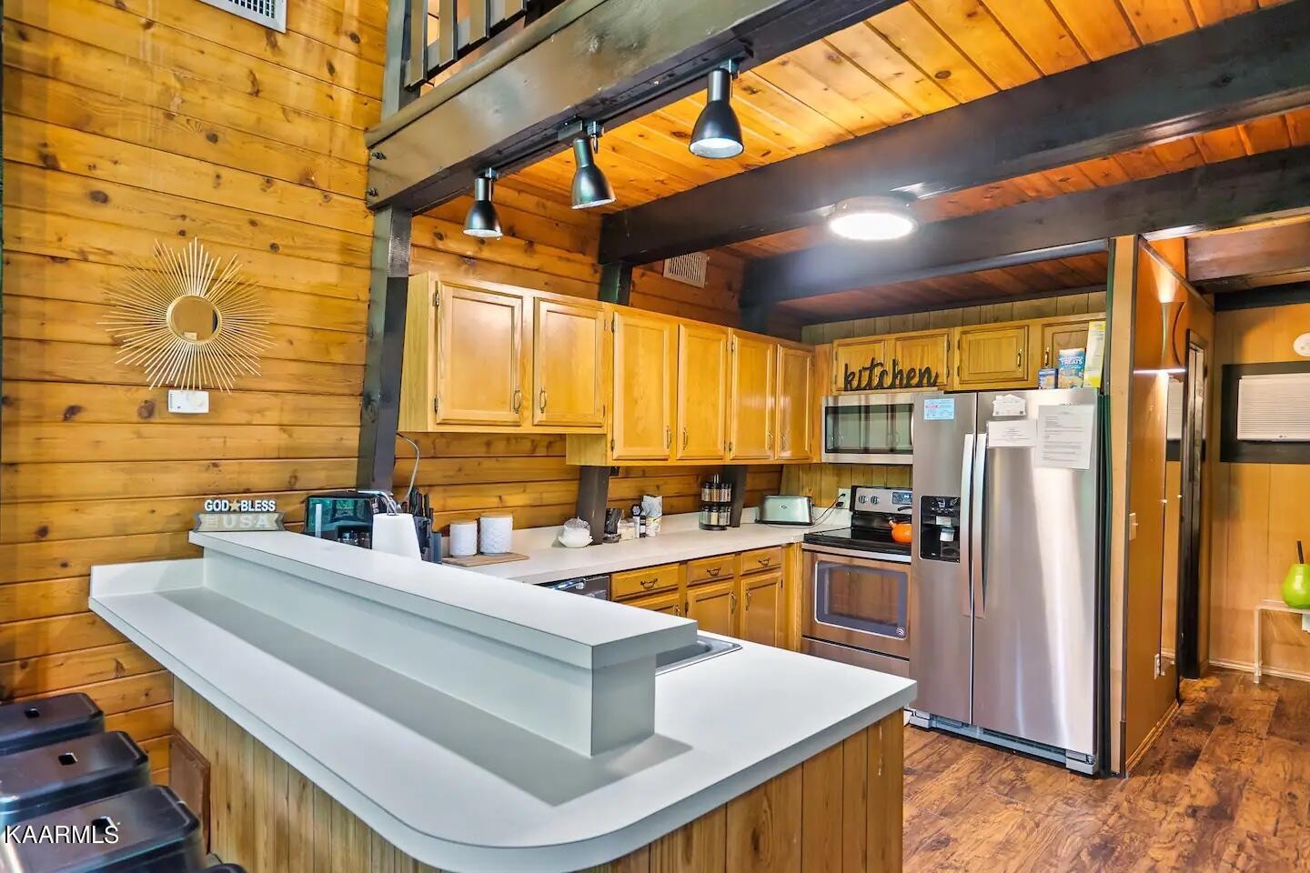 1424 Zurich Road Gatlinburg, TN 37738 - Photo 8 of 27 a kitchen with stainless steel appliances granite countertop a sink stove and refrigerator