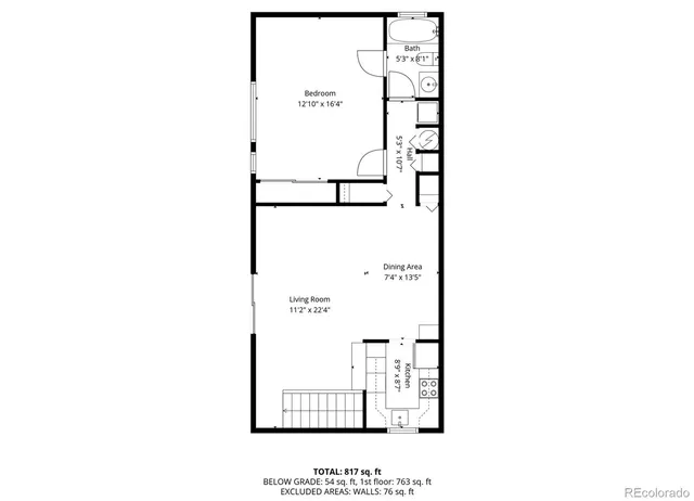 a picture of a bench in front of a wall