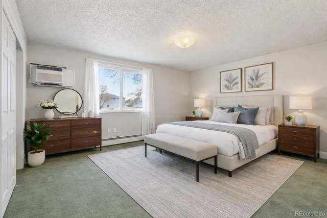 a bedroom with a bed and dresser