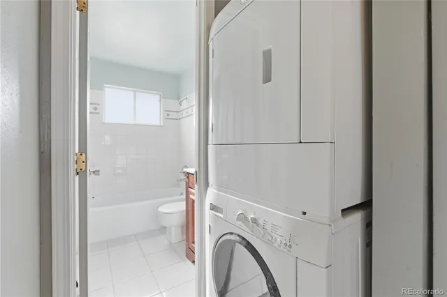 a view of bathroom with a washer and dryer
