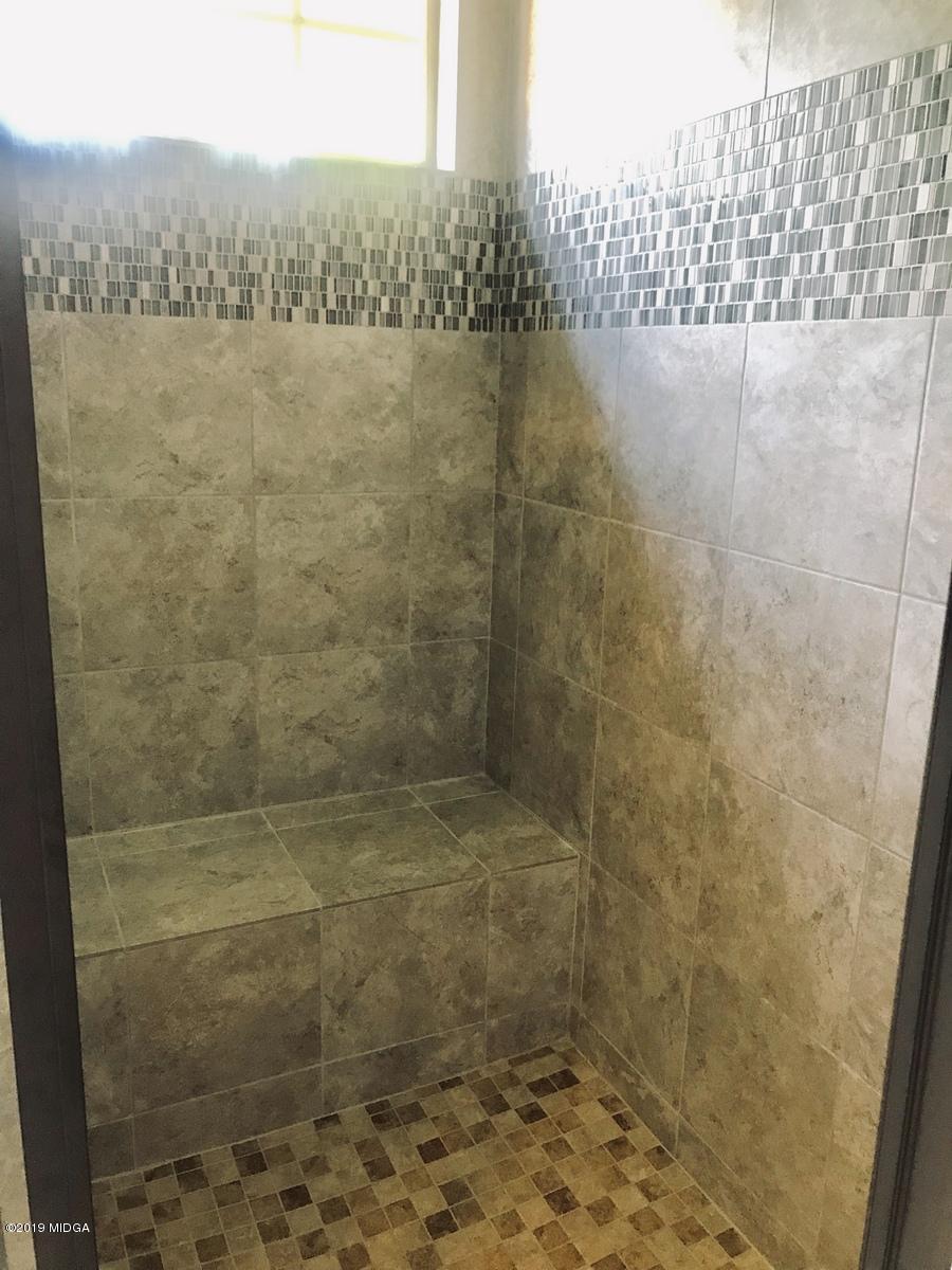 5890 Forsyth Road Macon, GA 31210 - Photo 8 of 11 a bathroom with a shower