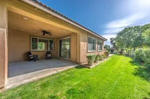 a view of a house with backyard and porch