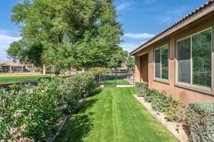 a view of house with backyard