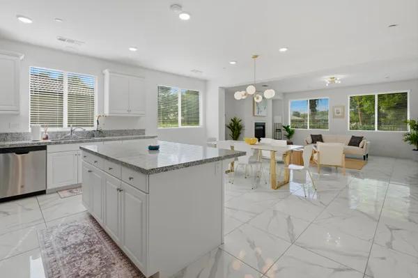 a view of living room with granite countertop furniture and window