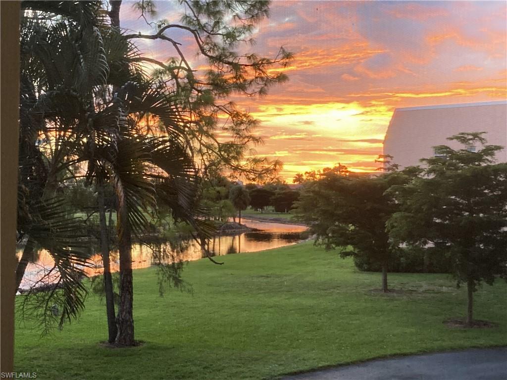 400 Forest Lakes Boulevard, Unit 210 Naples, FL 34105 - Photo 1 of 20 Sunset water view from balcony