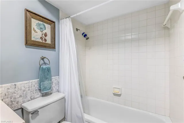 a dining room with furniture and a book shelf