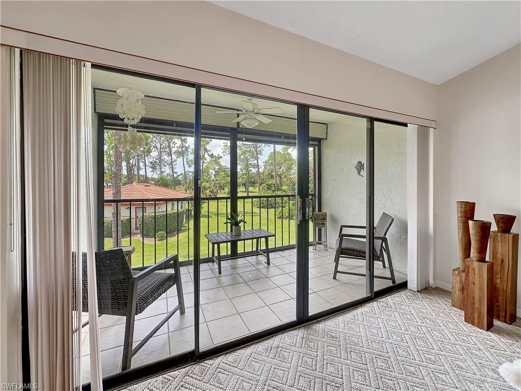 905 Augusta Boulevard, Unit 9056 Naples, FL 34113 - Photo 15 of 28 Entryway with ceiling fan and light carpet