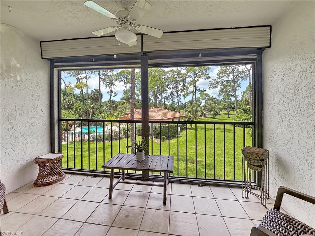 905 Augusta Boulevard, Unit 9056 Naples, FL 34113 - Photo 16 of 28 Sunroom featuring ceiling fan