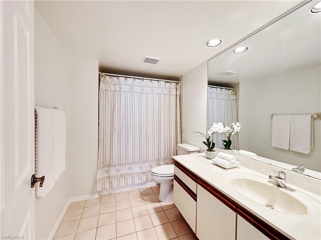 905 Augusta Boulevard, Unit 9056 Naples, FL 34113 - Photo 20 of 28 Bathroom featuring tile patterned flooring, vanity, and toilet