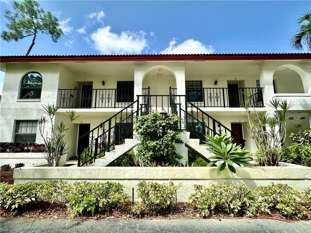 905 Augusta Boulevard, Unit 9056 Naples, FL 34113 - Photo 3 of 28 View of front of house with a balcony