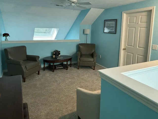 a living room with furniture and a table