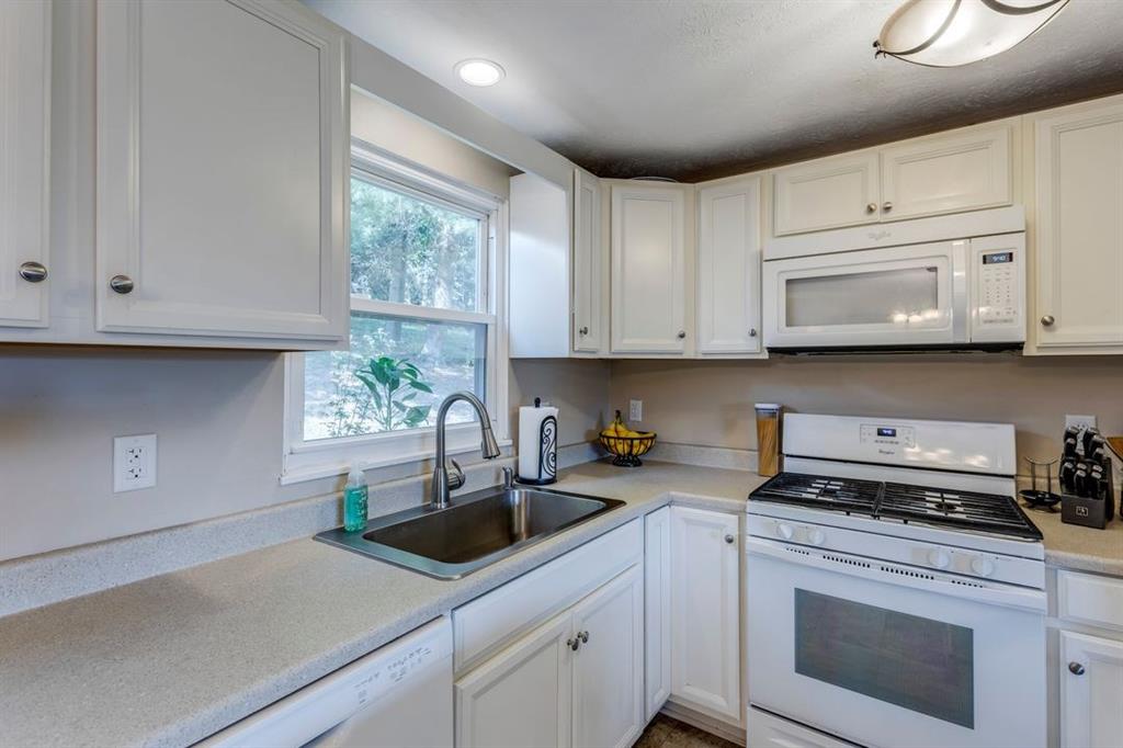 133 Glengarry Drive Coraopolis, PA 15108 - Photo 11 of 24 a kitchen with appliances cabinets and a window