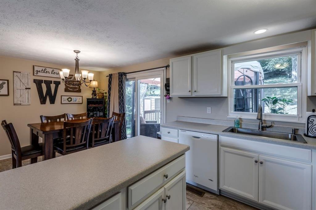 133 Glengarry Drive Coraopolis, PA 15108 - Photo 13 of 24 a kitchen that has a lot of cabinets in it and wooden floors