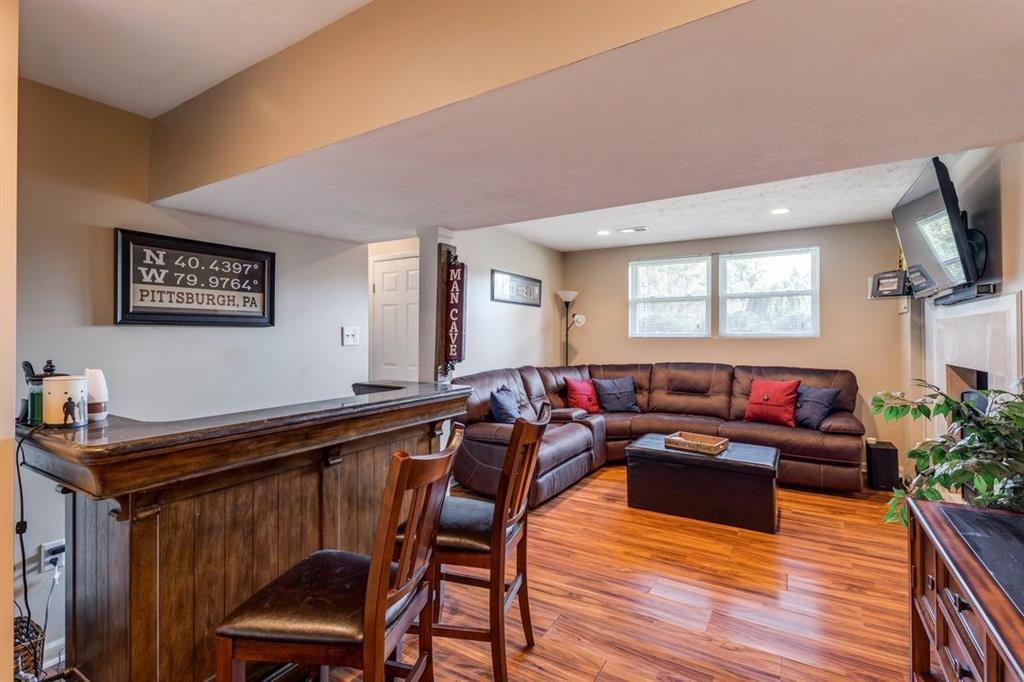 133 Glengarry Drive Coraopolis, PA 15108 - Photo 22 of 24 a living room with furniture and a flat screen tv