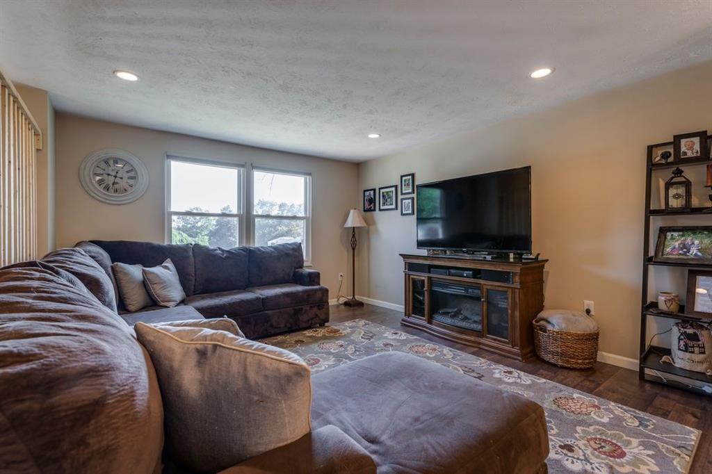 133 Glengarry Drive Coraopolis, PA 15108 - Photo 4 of 24 a living room with furniture and a flat screen tv