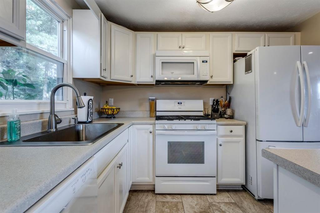 133 Glengarry Drive Coraopolis, PA 15108 - Photo 10 of 24 a kitchen with white cabinets white stainless steel appliances and sink