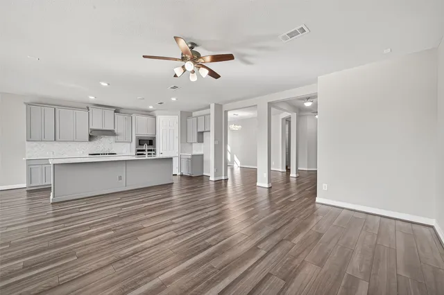 a view of kitchen with wooden floor and window