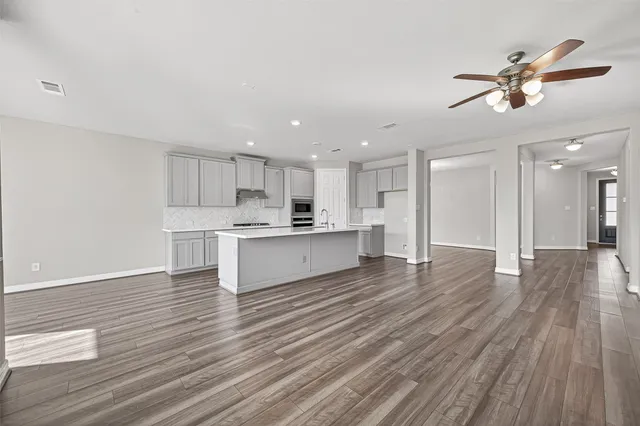 a view of kitchen with wooden floor and window