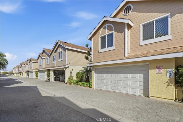 a view of a white house with large windows