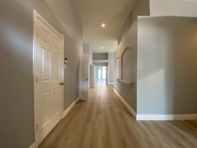 1512 Lorson Loop Round Rock, TX 78665 - Photo 6 of 29 a view of a hallway with wooden floor