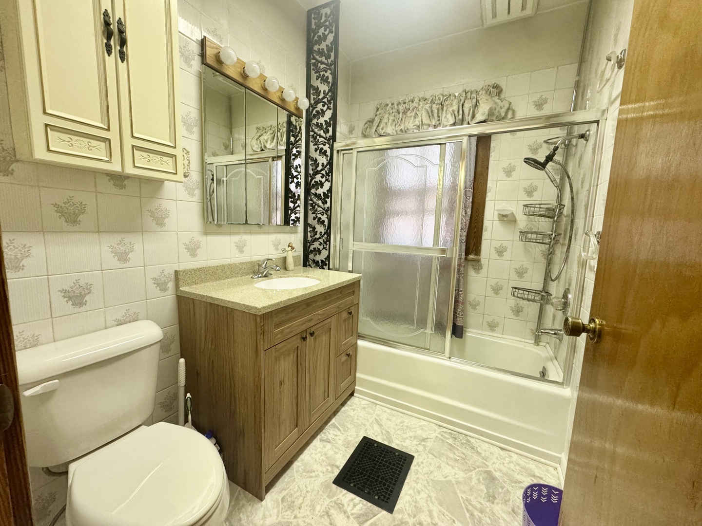 303 South Elm Street Clinton, IL 61727 - Photo 7 of 17 a bathroom with a sink a toilet and shower