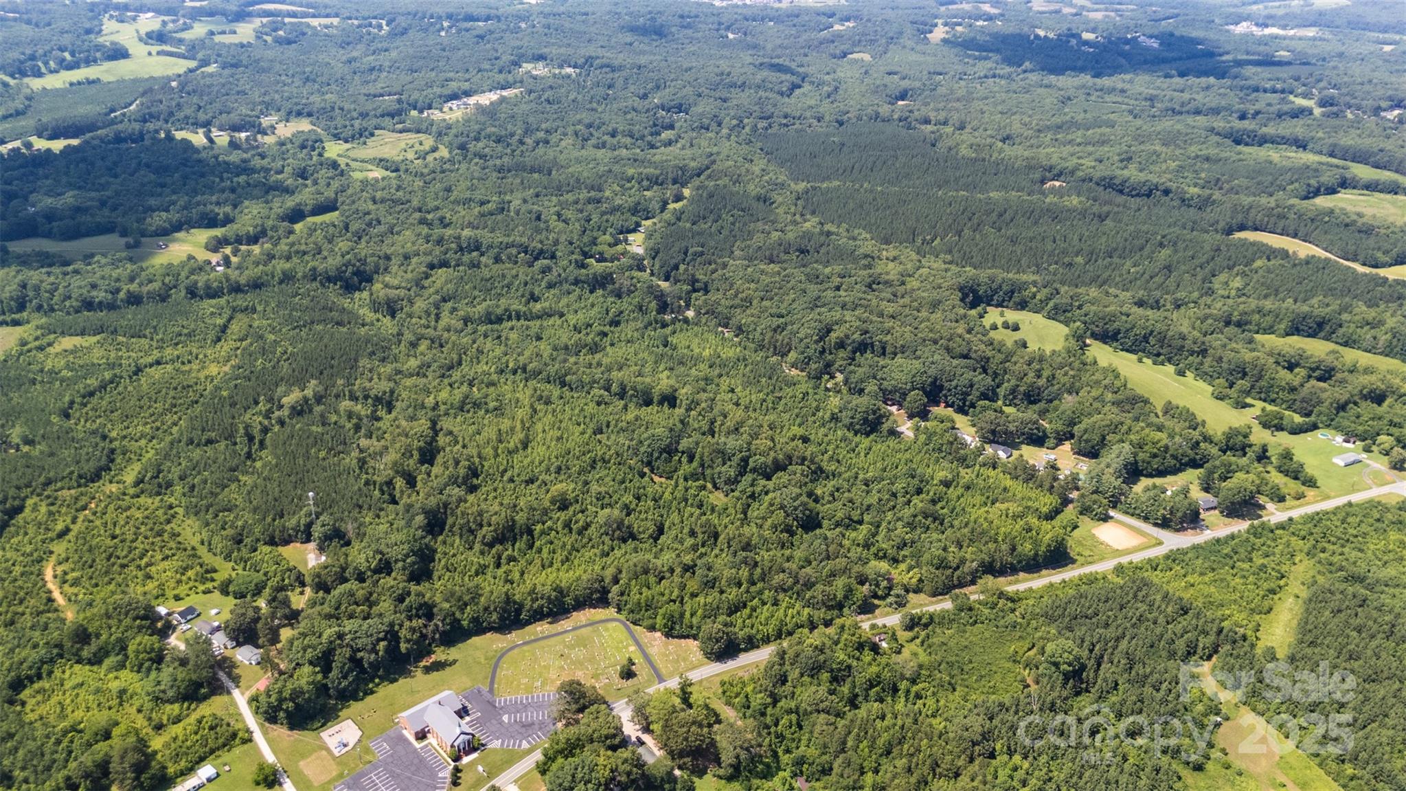 5600 Walters Mill Road Providence, NC 27315 - Photo 8 of 12 an aerial view of a house with a yard