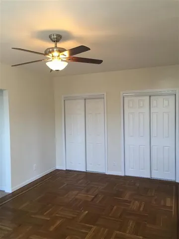 a view of a livingroom and a chandelier fan