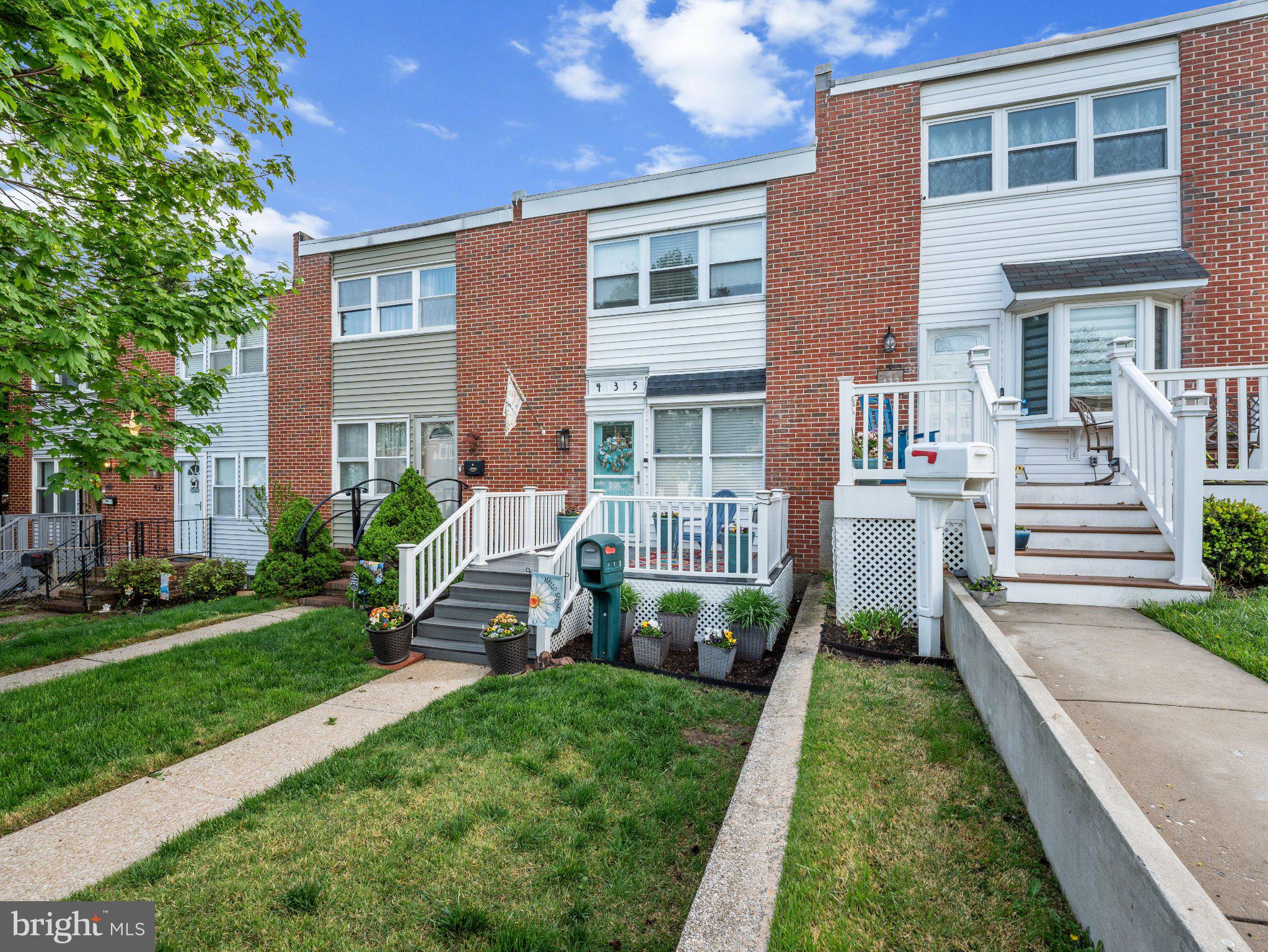 435 Seward Avenue Baltimore, MD 21225 - Photo 4 of 22 Charming townhomes with lush greenery.