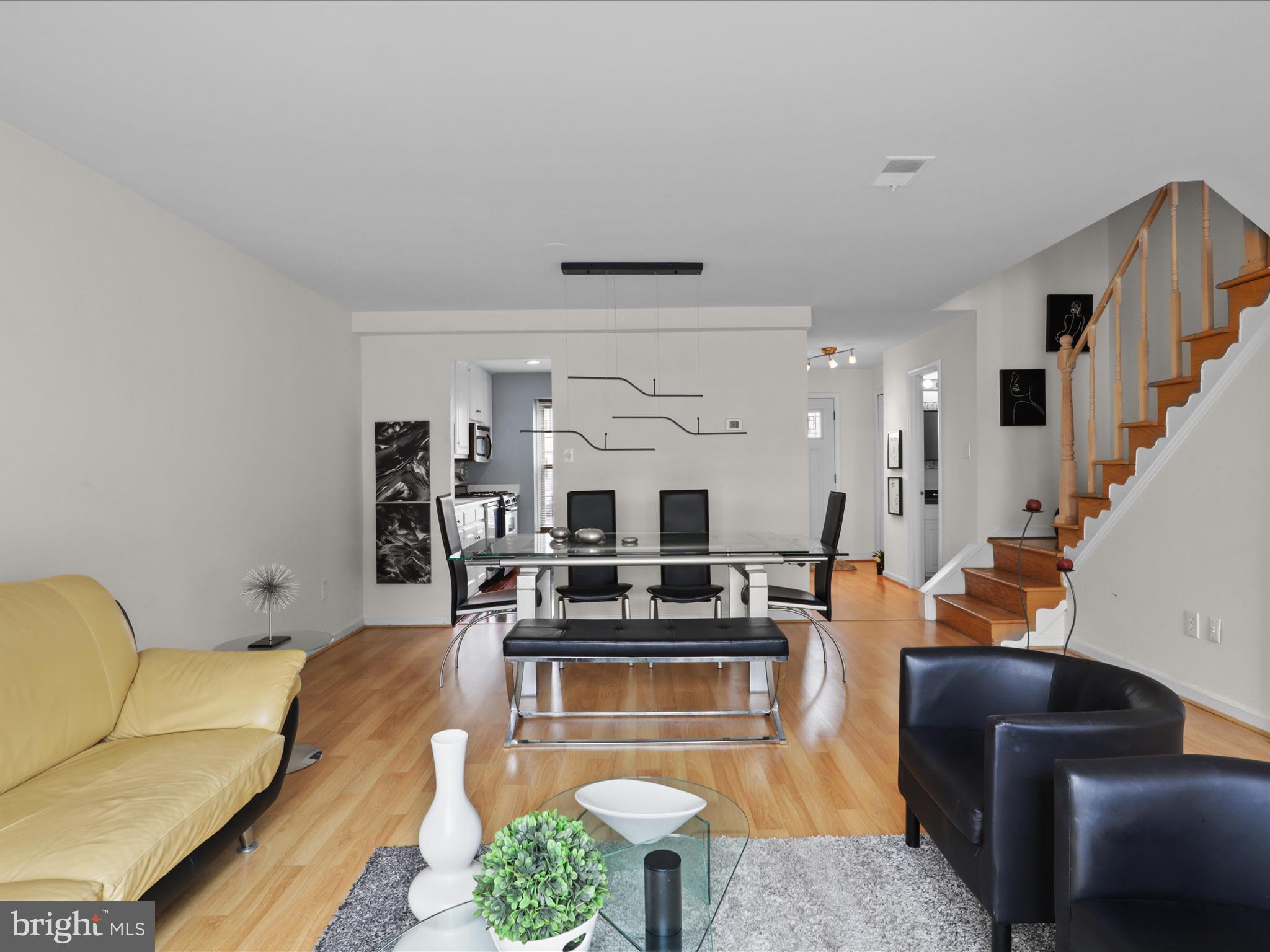 8068 Dulciana Court Springfield, VA 22153 - Photo 16 of 36 a living room with furniture and wooden floor