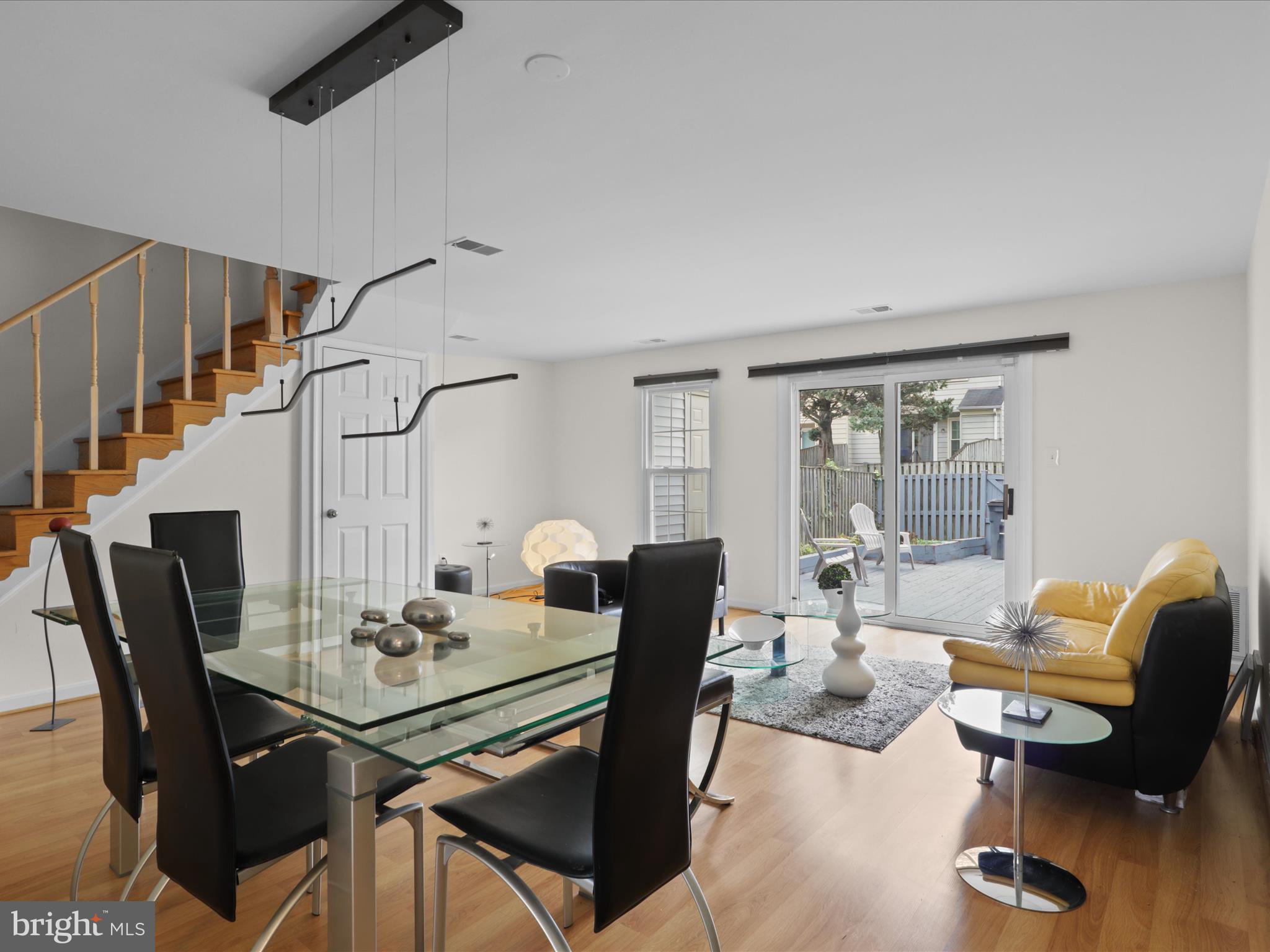 8068 Dulciana Court Springfield, VA 22153 - Photo 8 of 36 a view of a dining room with furniture window and wooden floor