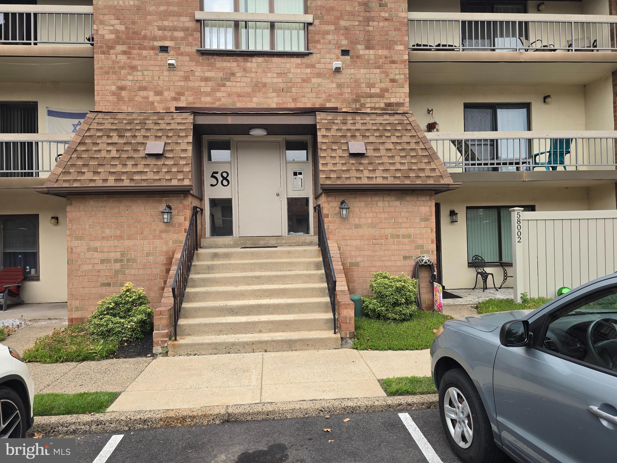 58201 Delaire Landing Road, Unit 201 Philadelphia, PA 19114 - Photo 1 of 11 a view of a car parked front of a building