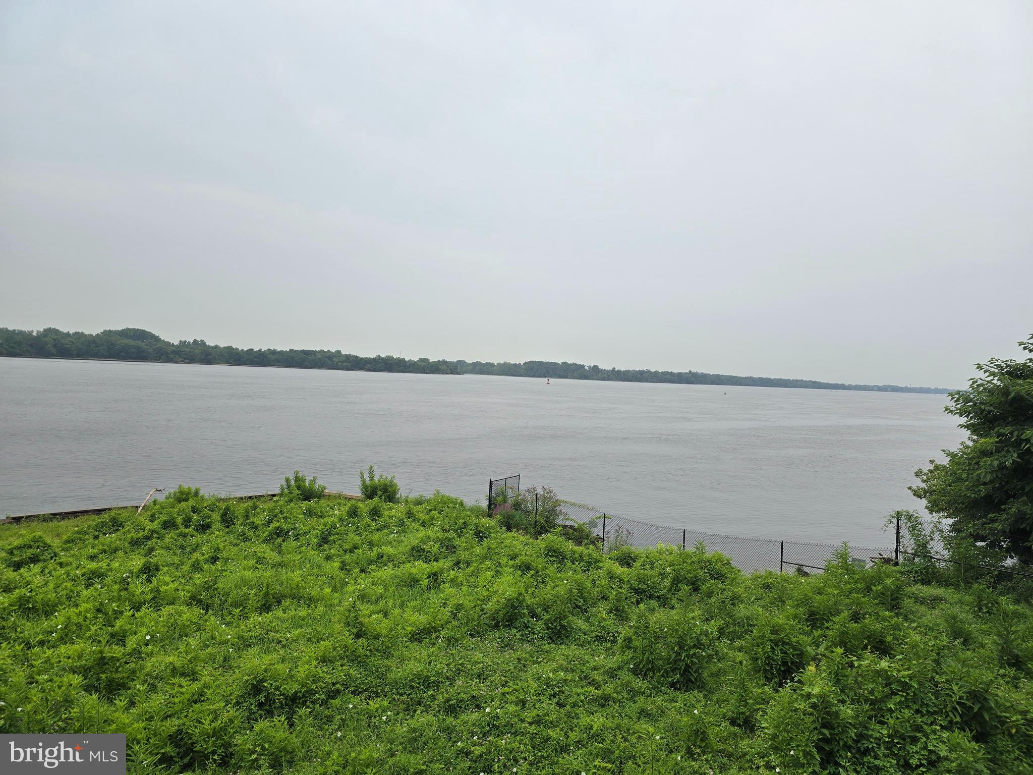 58201 Delaire Landing Road, Unit 201 Philadelphia, PA 19114 - Photo 2 of 11 a view of a lake with a big yard