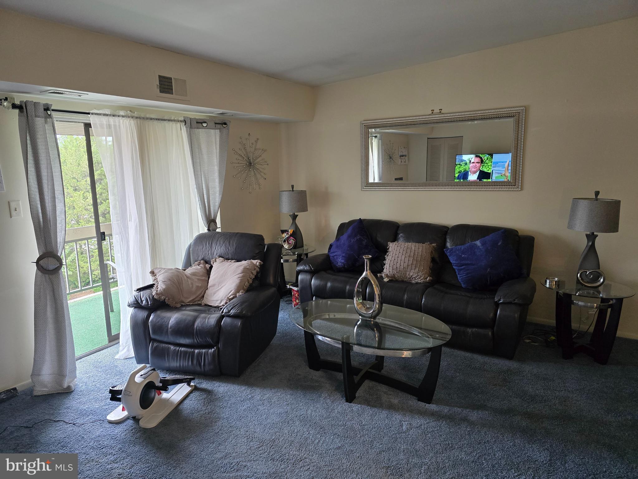 58201 Delaire Landing Road, Unit 201 Philadelphia, PA 19114 - Photo 8 of 11 a living room with furniture and a window