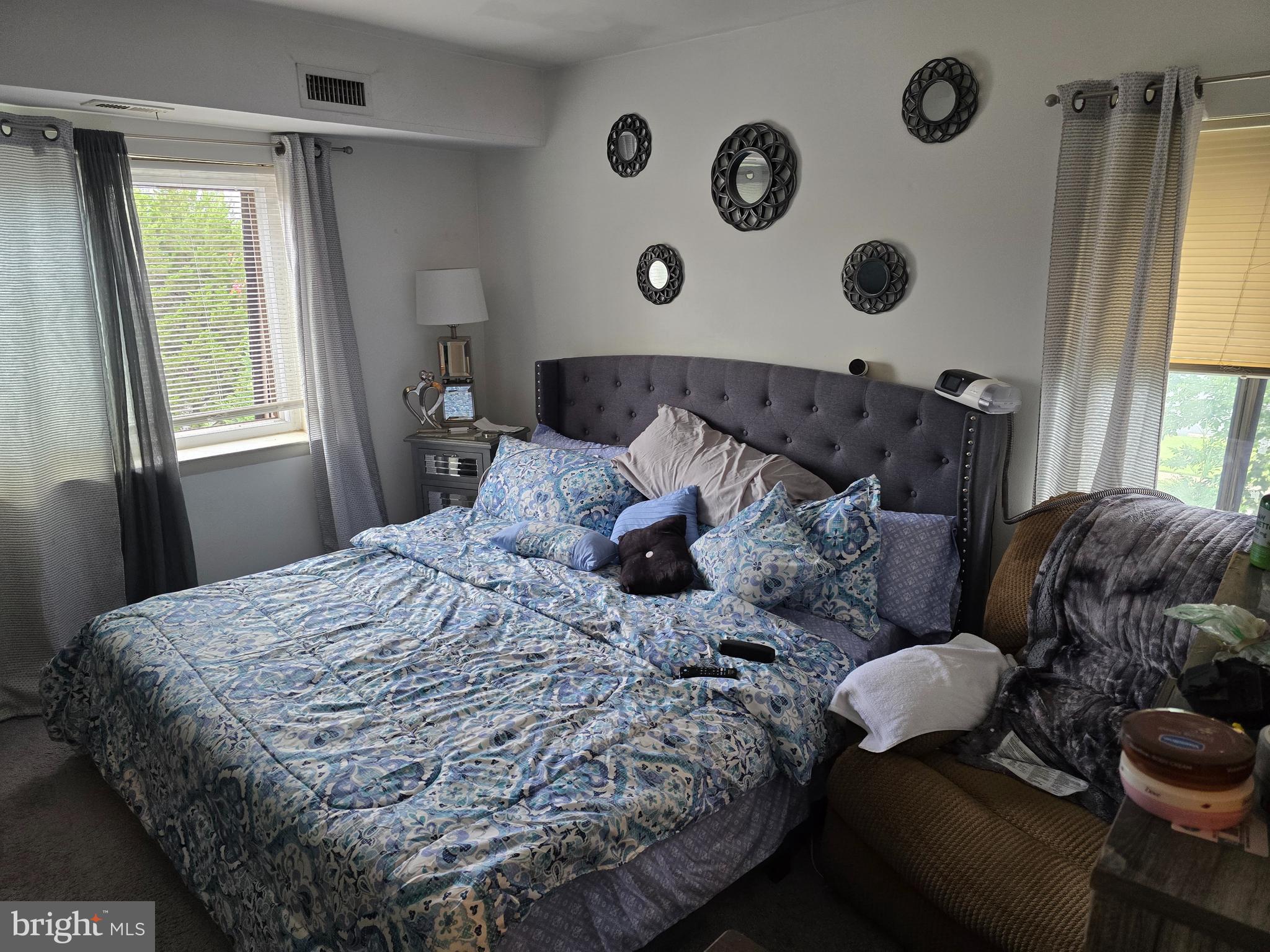 58201 Delaire Landing Road, Unit 201 Philadelphia, PA 19114 - Photo 9 of 11 a bed with a bed and a window