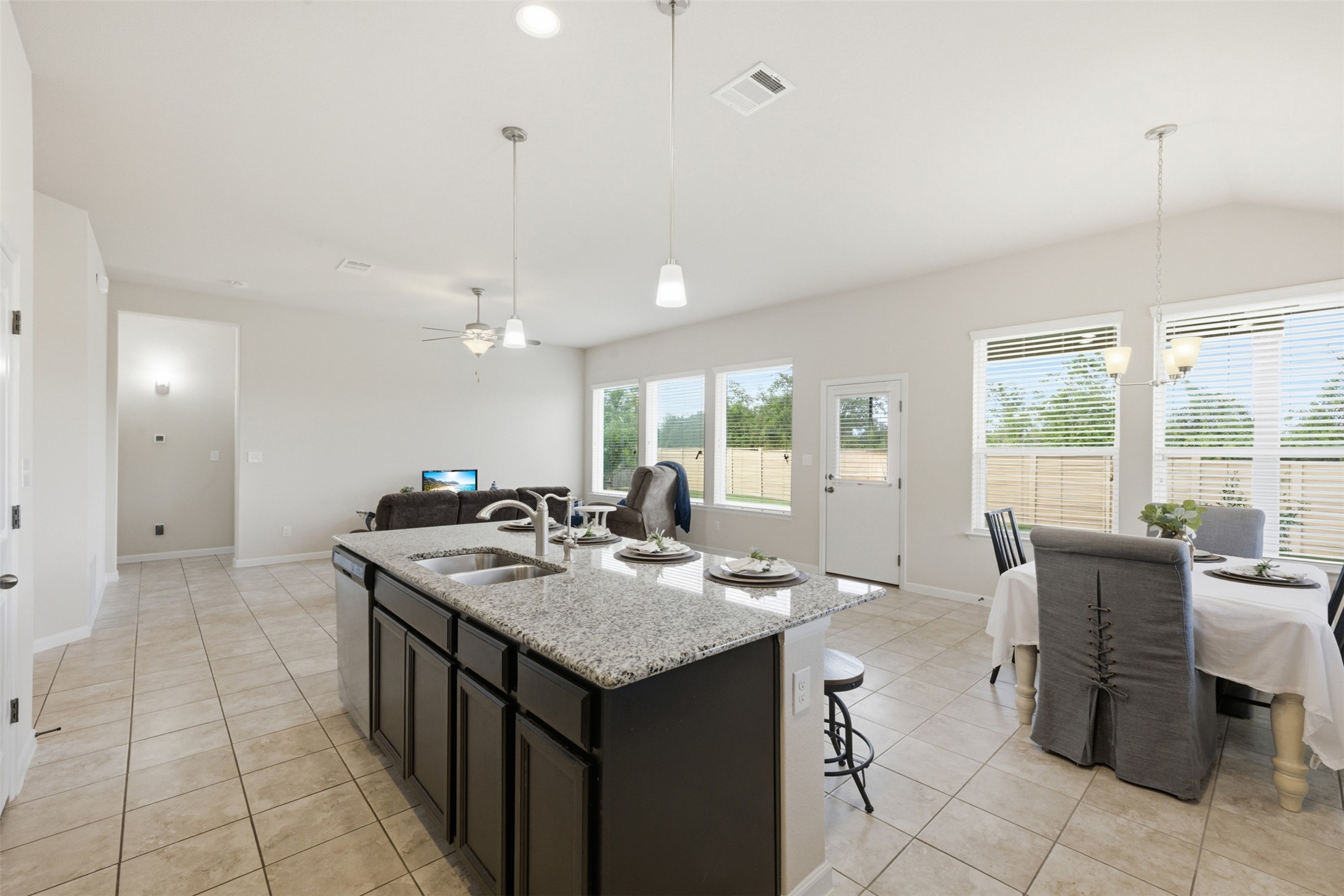 276 Gunnison Way Kyle, TX 78640 - Photo 8 of 28 a kitchen with a sink a counter top space and appliances
