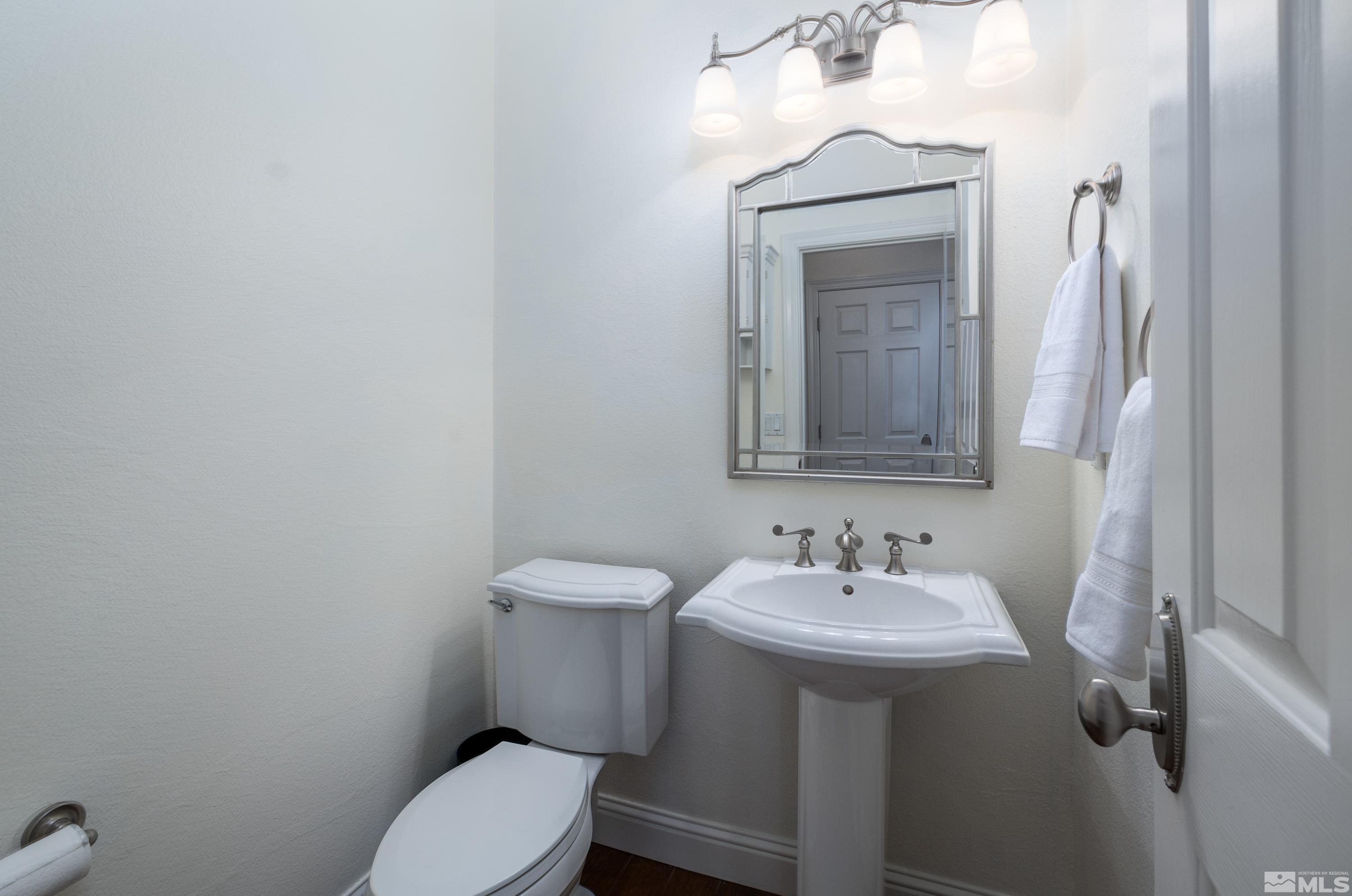 2585 Baton Drive Reno, NV 89521 - Photo 11 of 28 a bathroom with a toilet sink and mirror