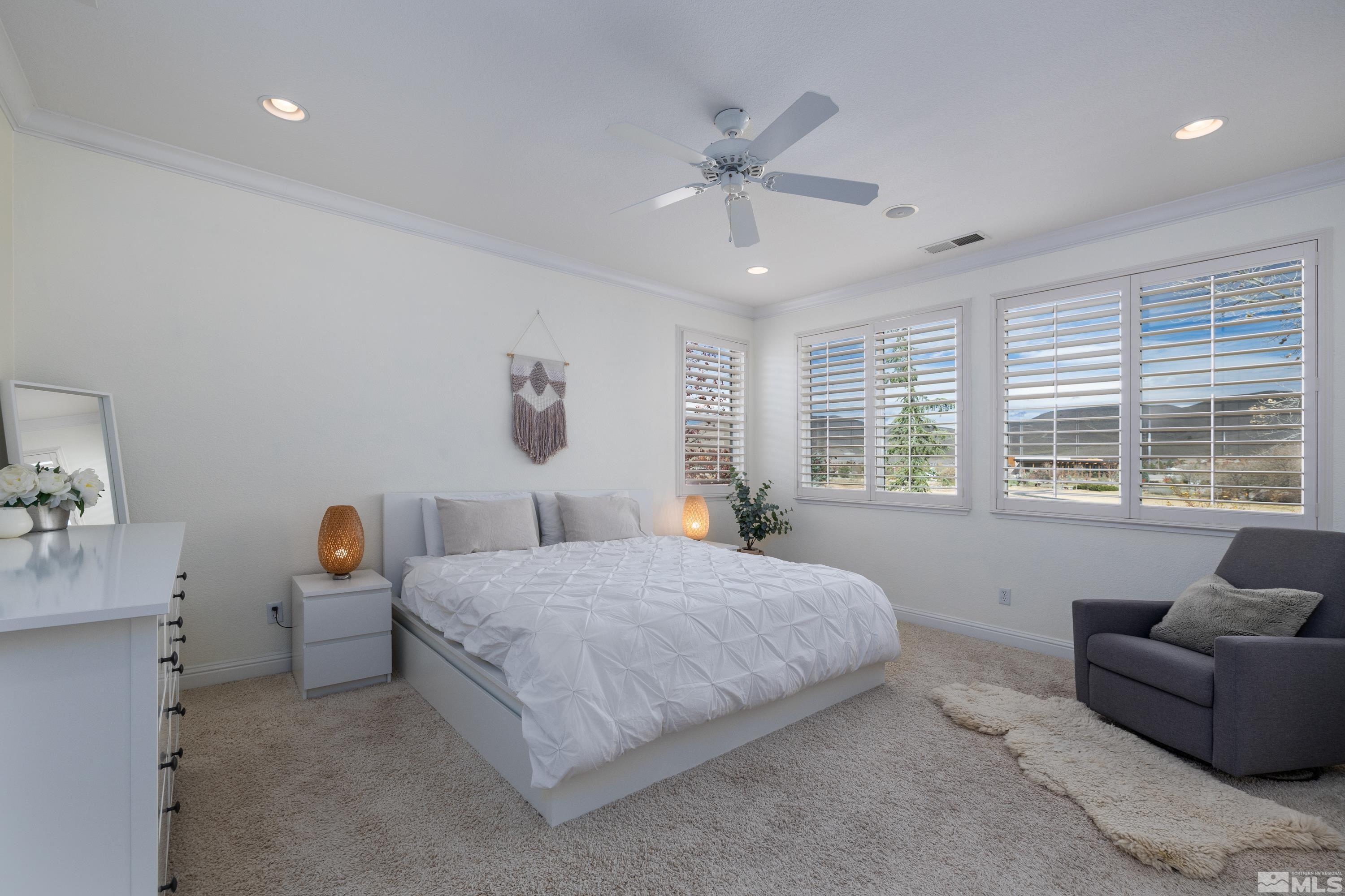 2585 Baton Drive Reno, NV 89521 - Photo 17 of 28 a bedroom with a bed couch and window