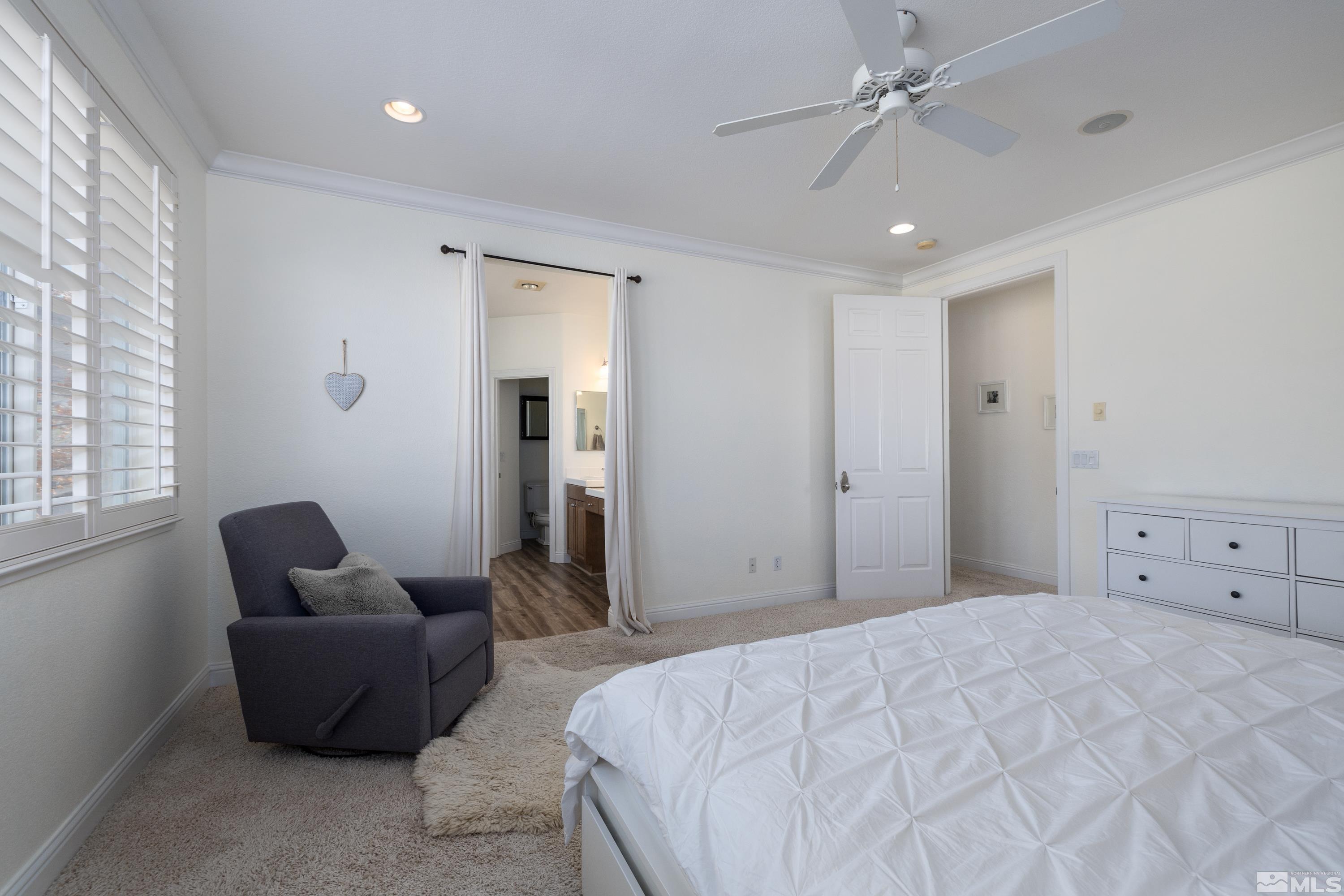 2585 Baton Drive Reno, NV 89521 - Photo 18 of 28 a spacious bedroom with a bed and furniture