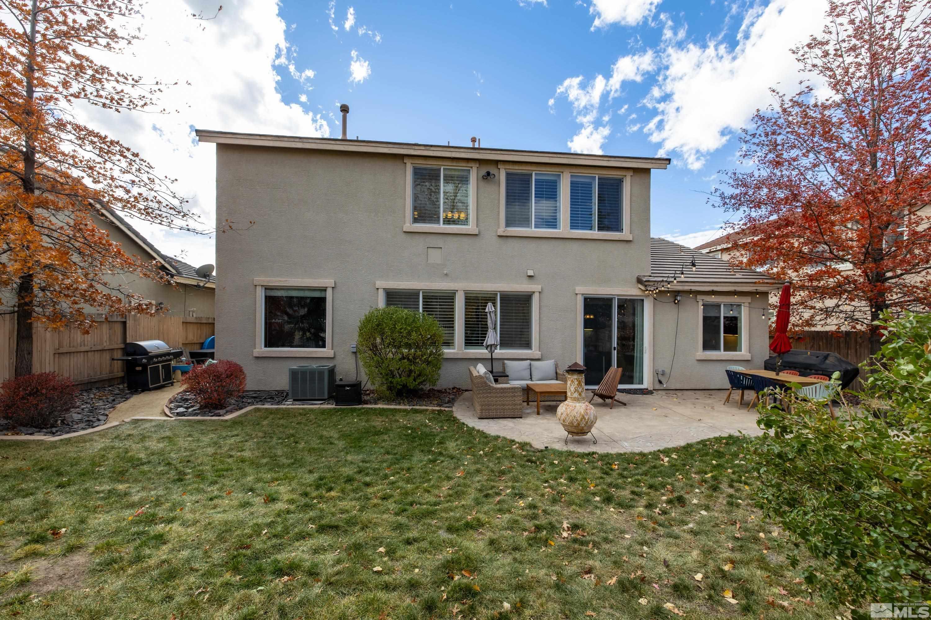 2585 Baton Drive Reno, NV 89521 - Photo 21 of 28 a front view of a house with garden and patio