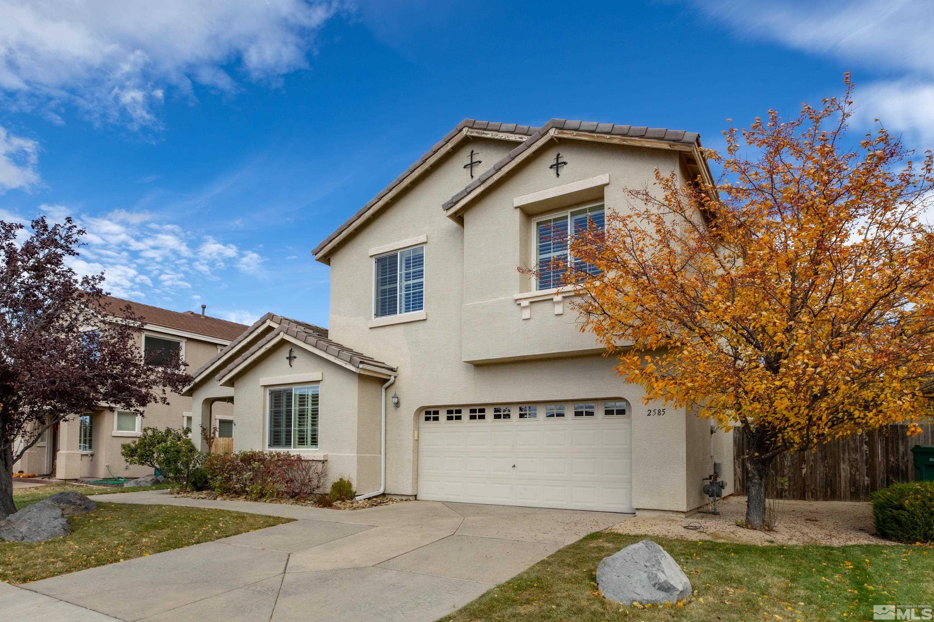 2585 Baton Drive Reno, NV 89521 - Photo 23 of 28 a front view of a house with a yard